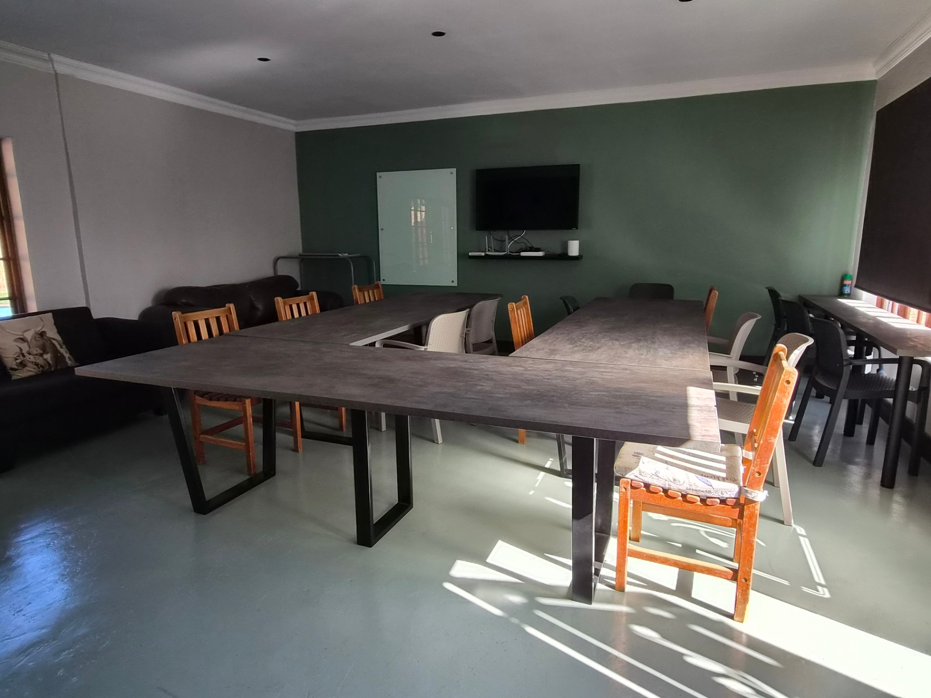 Conference room with TV, whiteboard and seating
