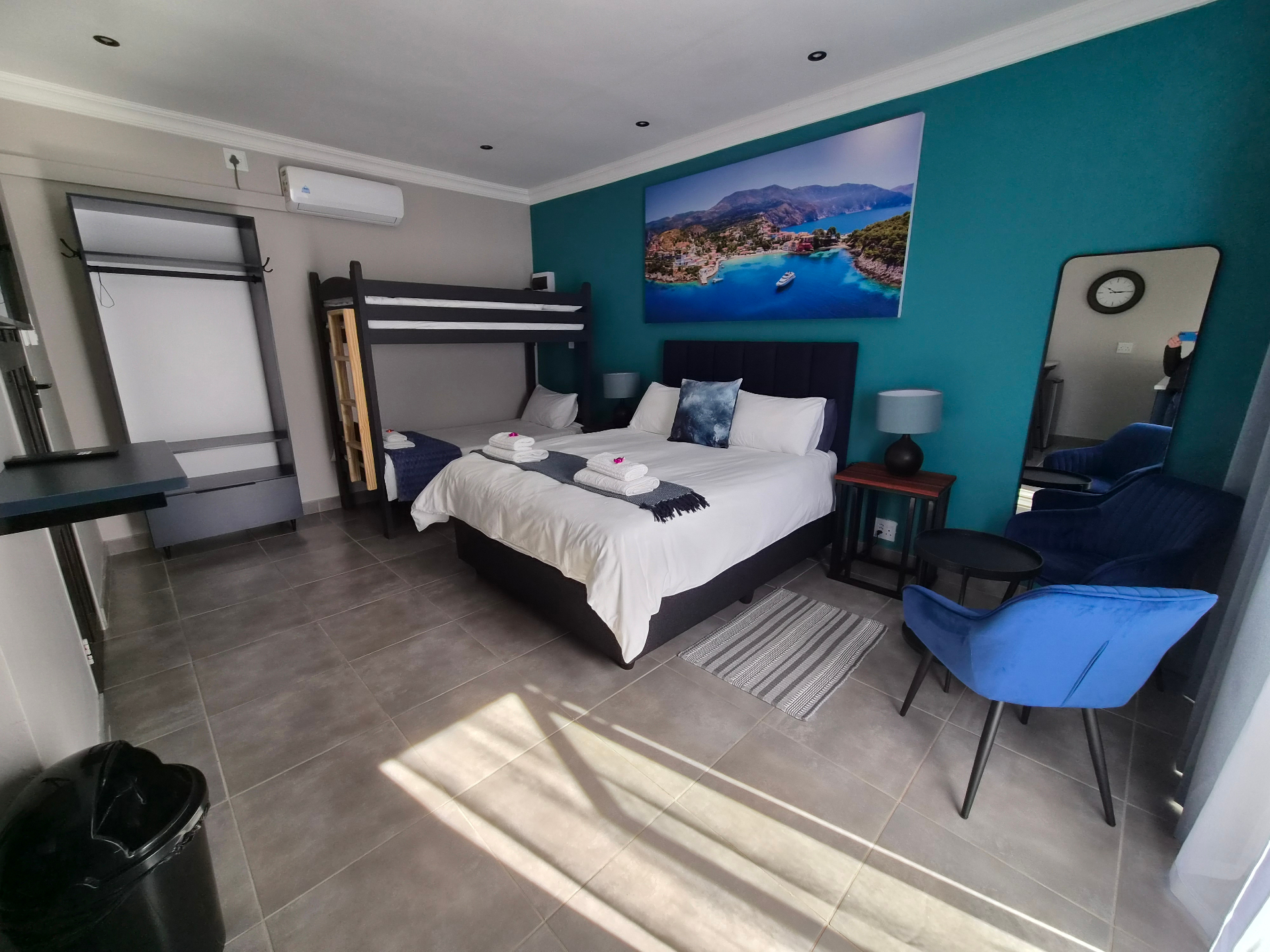 Room Frantoio interior with teal feature wall