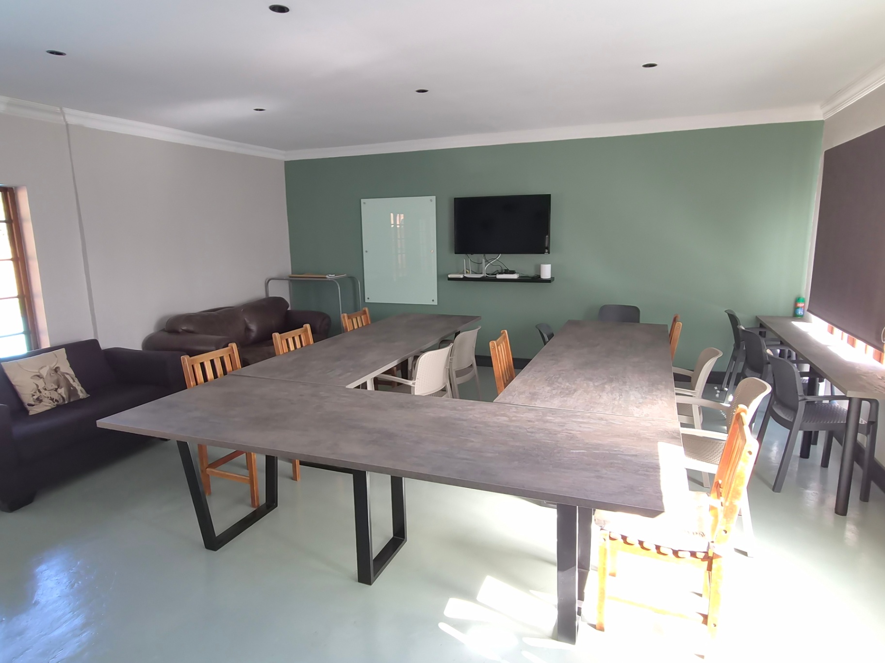 Conference room with large tables and seating