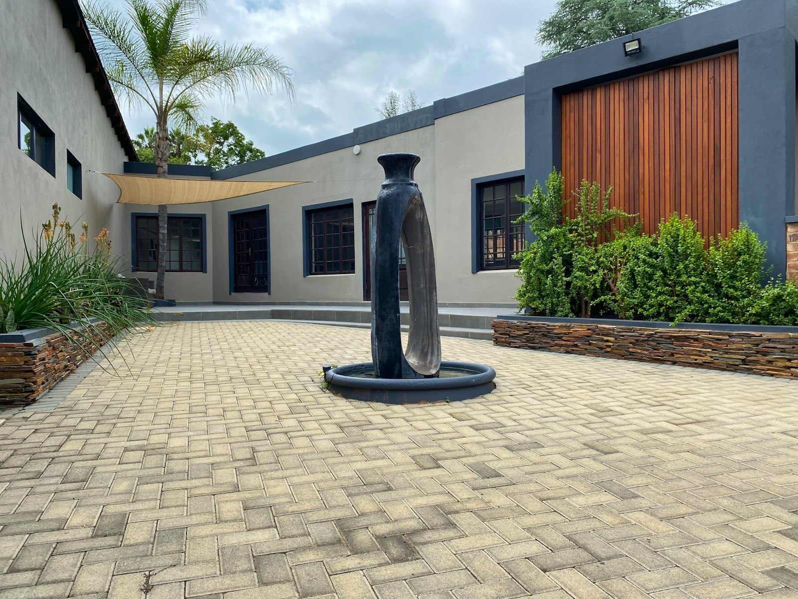 Blue Olive Guesthouse garden among olive trees in Pretoria East